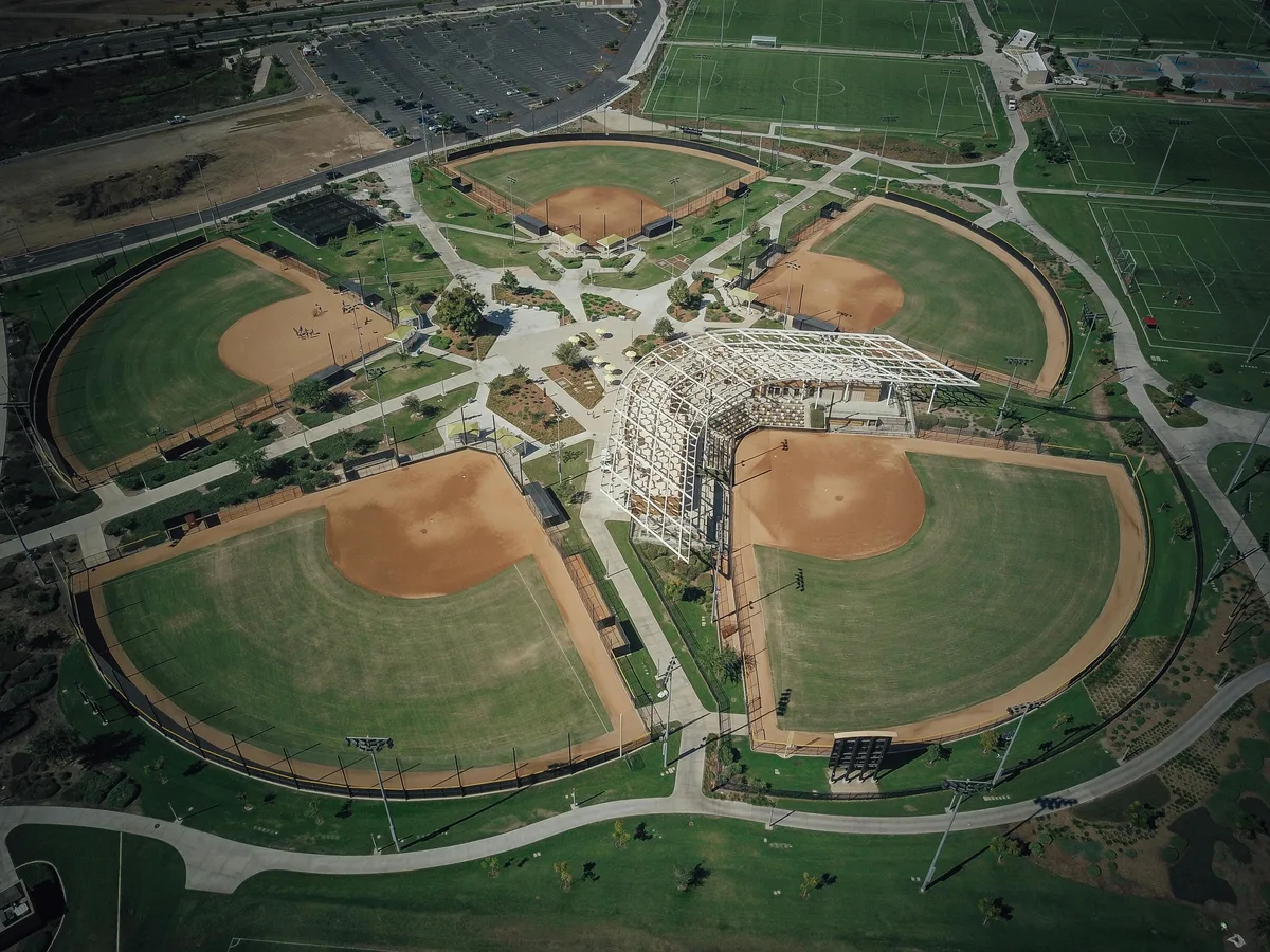 Aerial view of interconnected baseball field complex with multiple diamonds