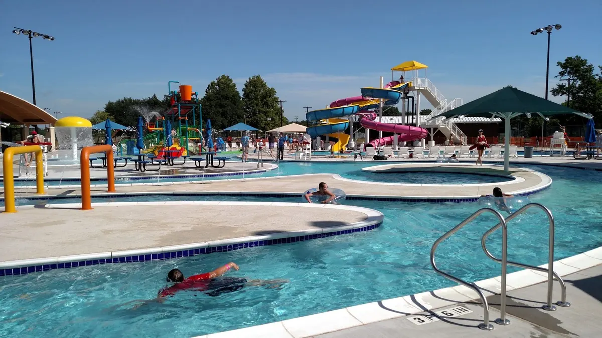 Boomtown Bay Water Park with pool, colorful slides, and kiddie splash zone in Burkburnett TX