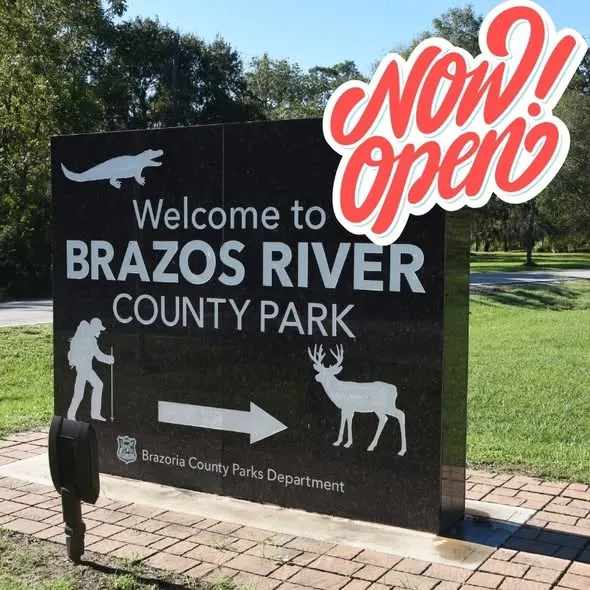 Playground and wooded trail at Brazos River County Park — Angleton, TX
