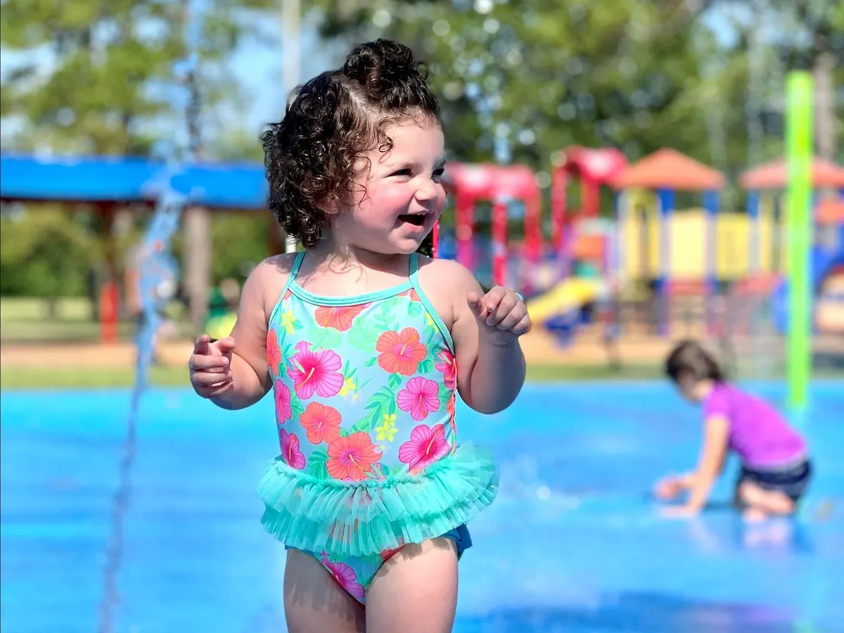 Child playing at a Beaumont TX splash pad — Charlton Pollard Park