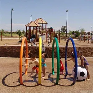 Kids enjoying ground spray jets at Chuparosa Park Spray Pad — Chandler, AZ