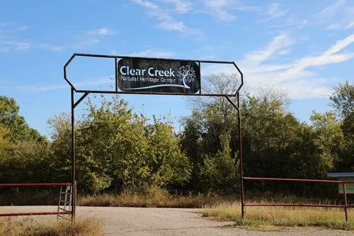 Clear Creek Natural Heritage Center entrance sign and woodland trail in Denton, TX