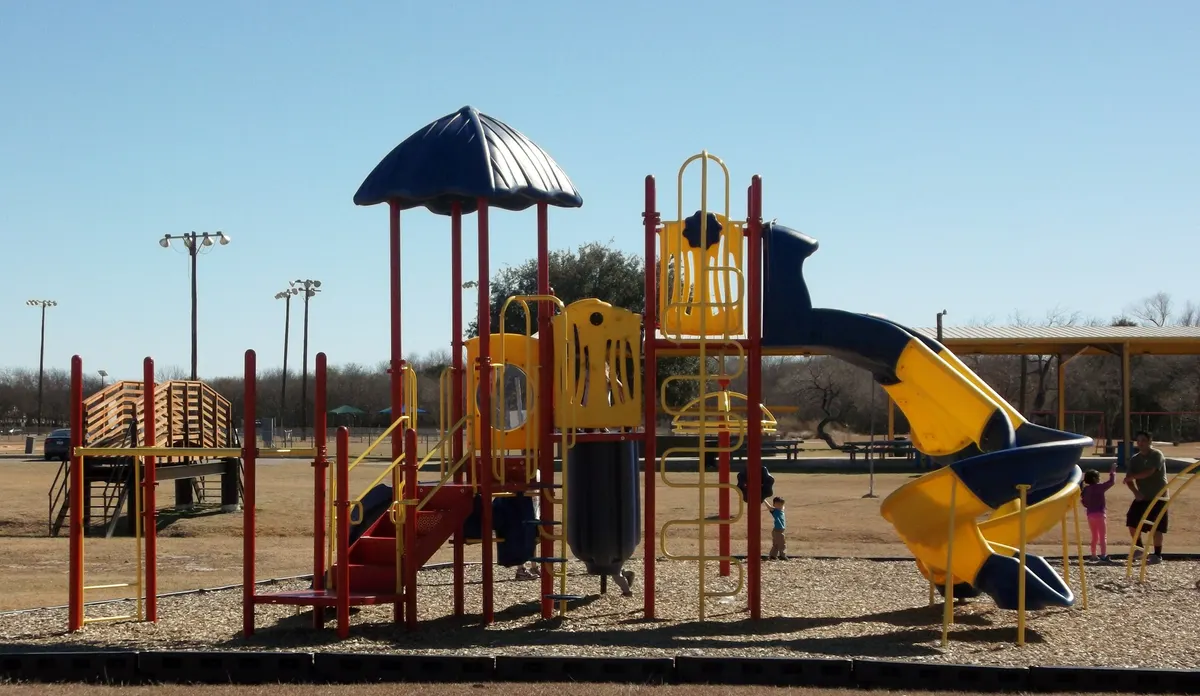 Age-split toddler and big-kid playgrounds at Converse City Park — Converse, TX