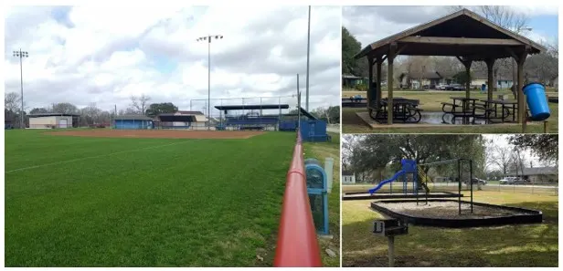 Playscape with monkey bars and merry-go-round at Croom Park 1 — Wharton, TX