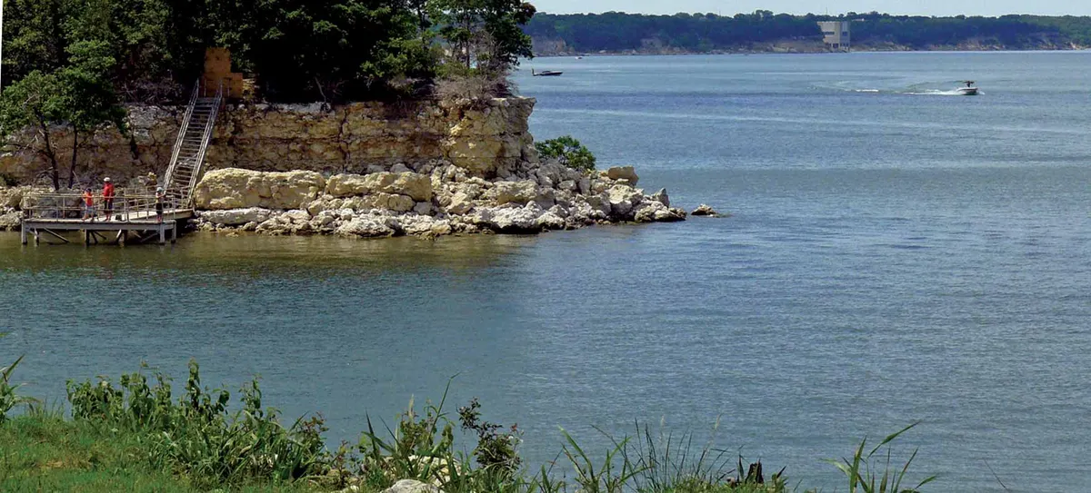Playground with swings and Lake Texoma views at Eisenhower State Park — Denison, TX