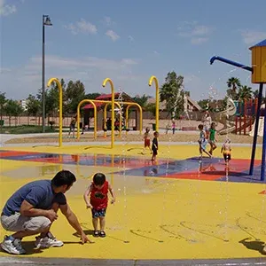 Kids playing at the water tower feature at Espee Park Spray Pad — Chandler, AZ