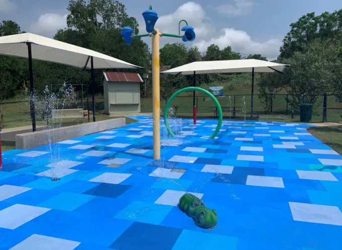 Fisherman's Park Splash Pad with water jets and alligator feature — Bastrop, TX