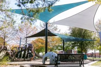 Shaded playground at Greenville Heights Park, Allen, TX