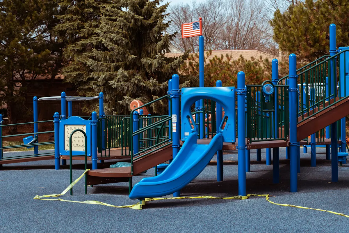 Kids playground with colorful slides and climbing structures