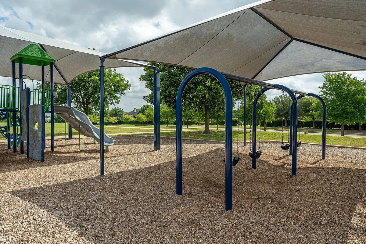 Shaded playground at Hill Top Park, McKinney, TX