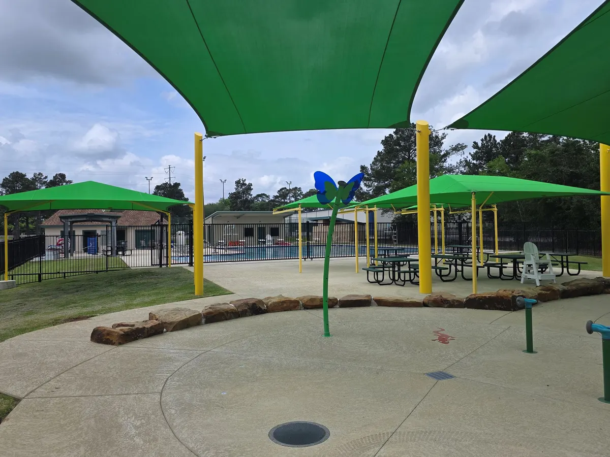 Splash pad and playground at Jerry Matheson Pool & Splash Pad — Tomball, TX