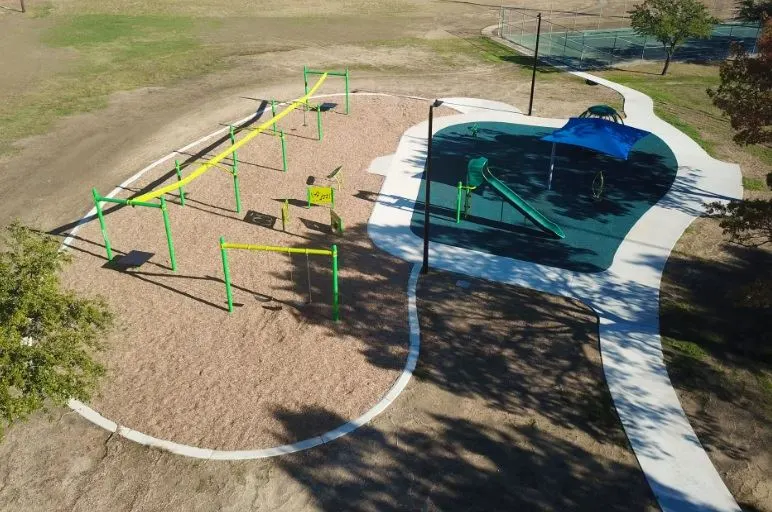 Shaded playground at Lou Huff Park, Garland, TX