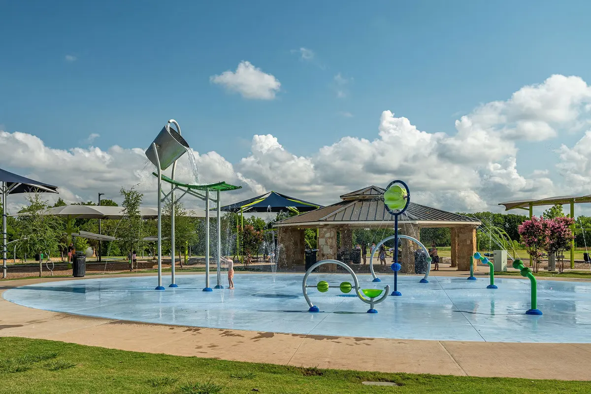 Covered play area with shade sails at Prestwyck Park — McKinney, TX