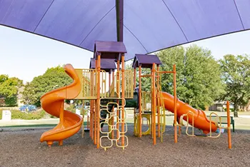 Shaded playground at Reed Park West, Allen, TX