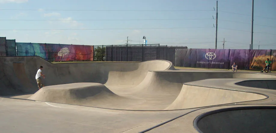 Concrete bowls and banked transitions at the Skate Park at Railroad Park, Lewisville, TX