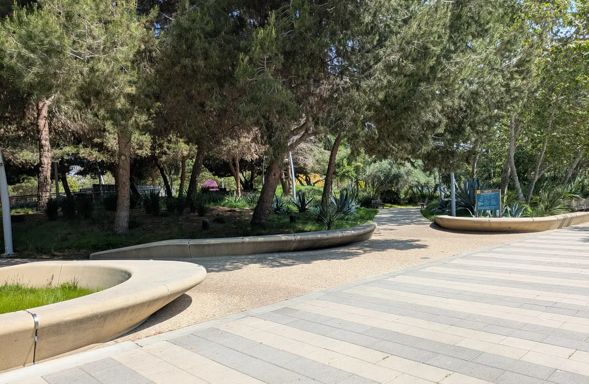Spongy turf playground with gentle fountain jets at Tongva Park — Santa Monica, CA