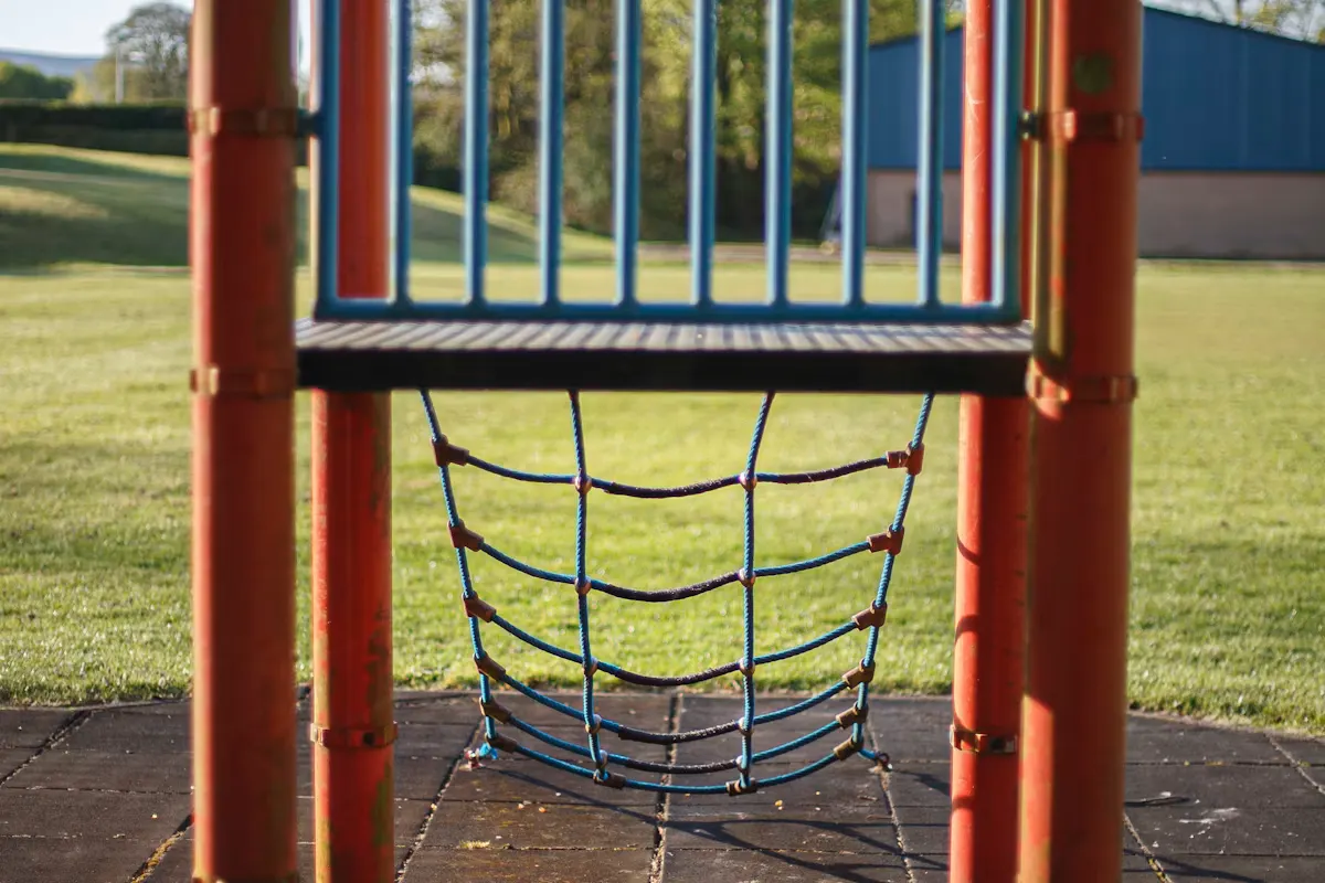 Playground climbing net and bars on a sunny day at a community park