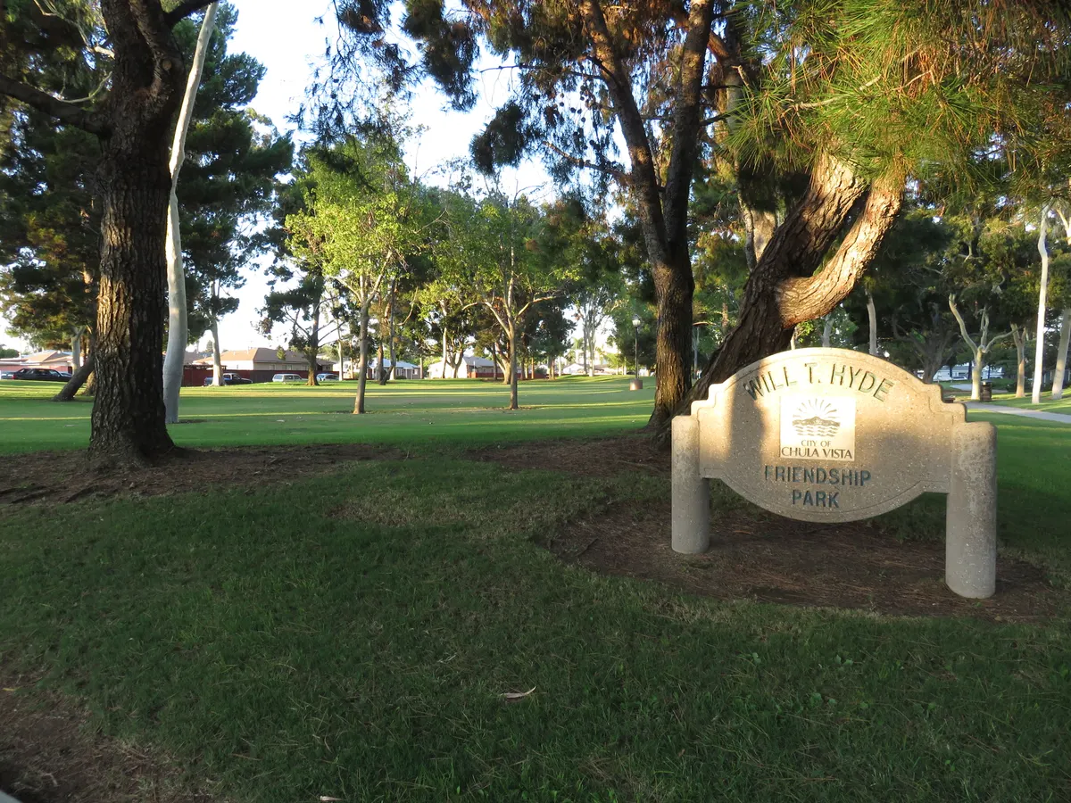 Shaded playground with swings at Will T. Hyde Friendship Park — Chula Vista, CA