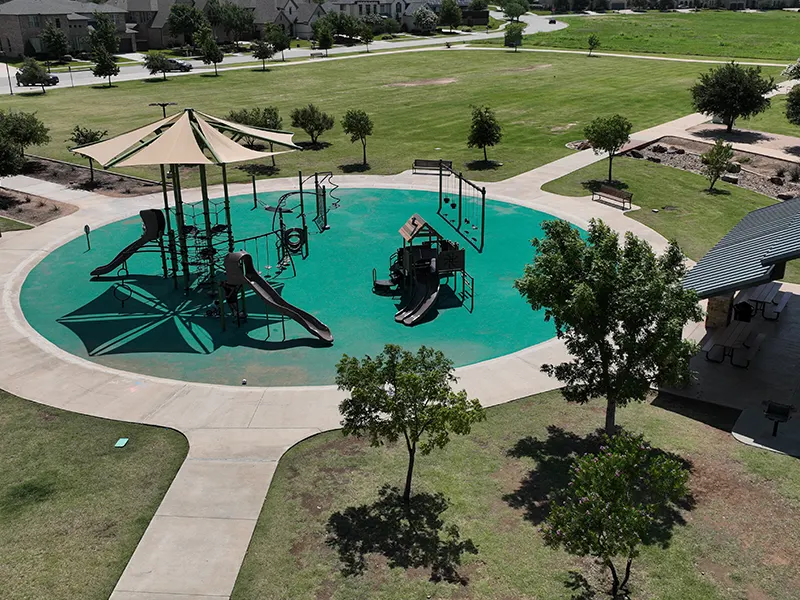 Shaded playground at Wranglers Range Park, Frisco, TX