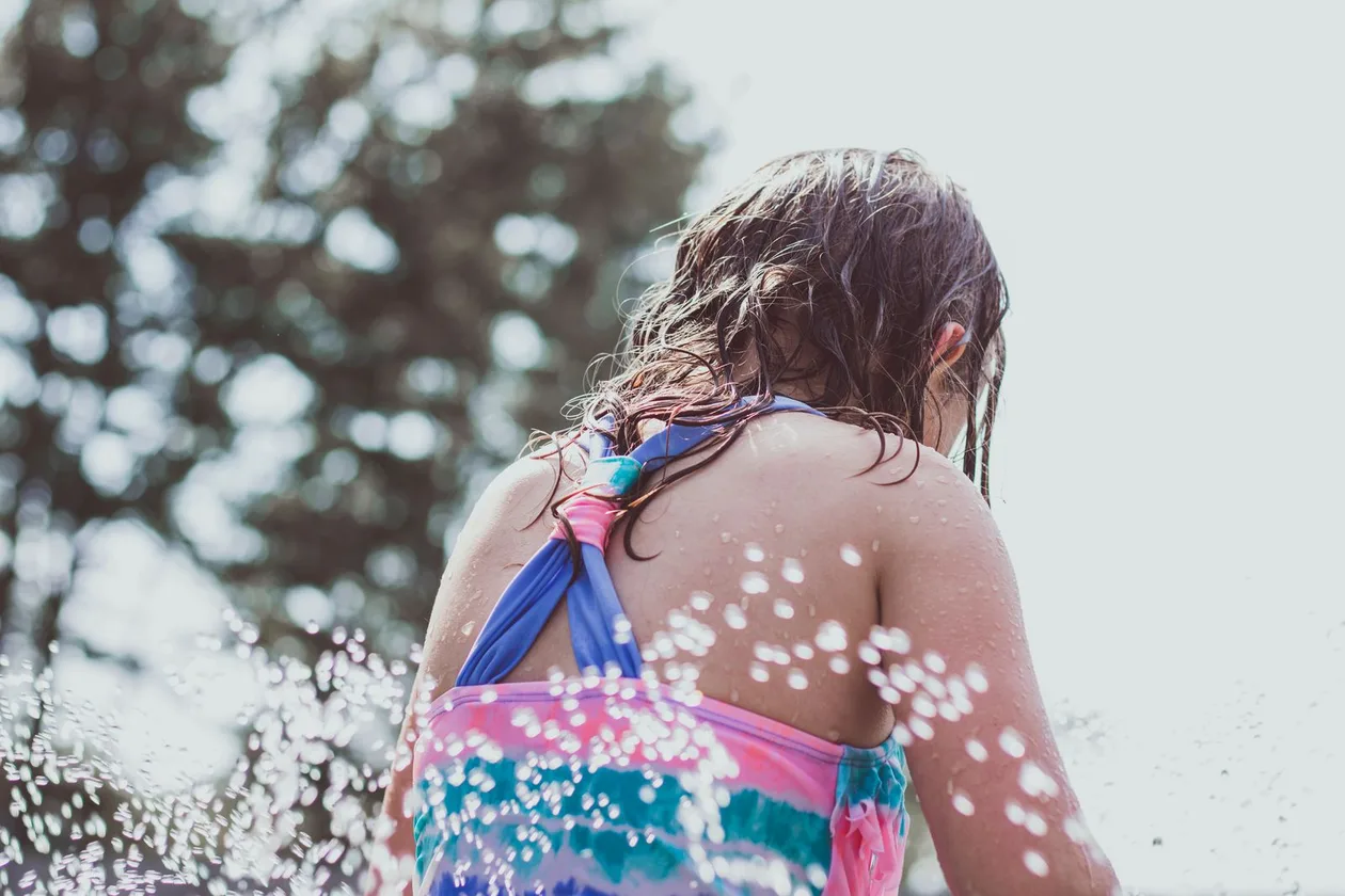 Children cooling off in a summer splash pad